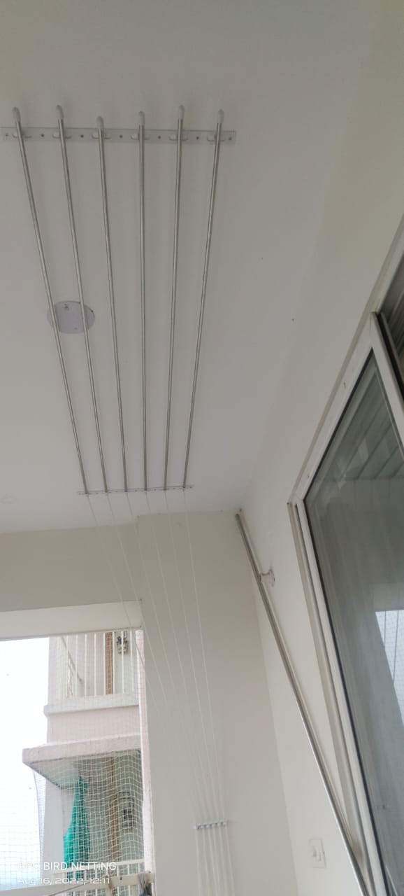 Ceiling cloth dryer hanger installed in a balcony